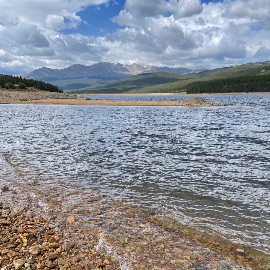 Lake with mountains in the background